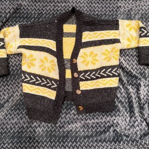 This knit cardigan is grey, off-white, and yellow with beautiful designs:)